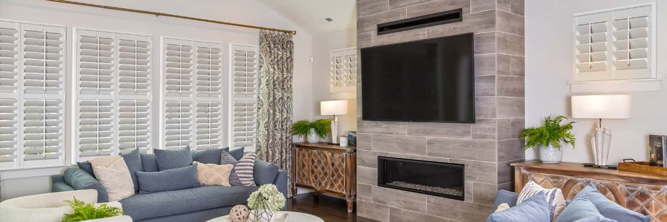 Interior shutters in Greenville living room with fireplace