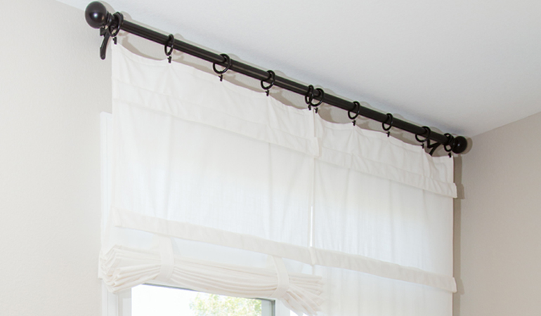 Tumble shades in Charlotte give your doors privacy versatility and style. White tumble shade on double glass doors