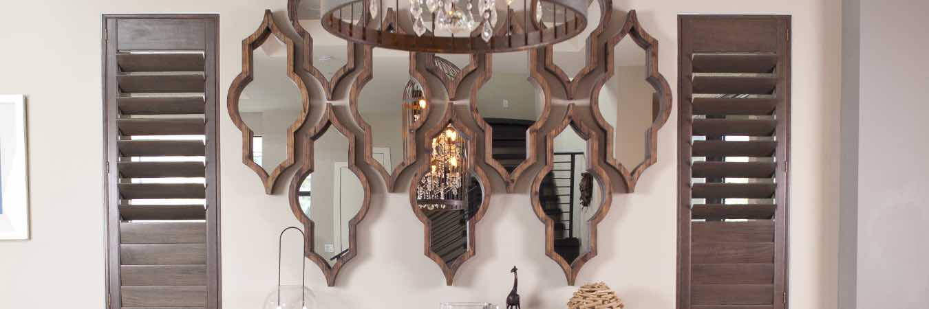 Brown wood shutters on elegant dining room windows