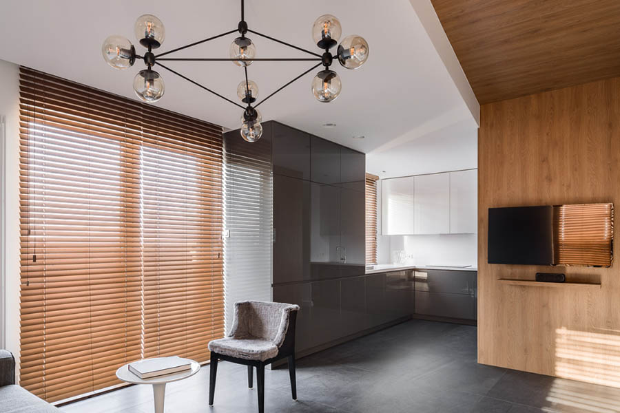 Brown wood window blinds on a large window