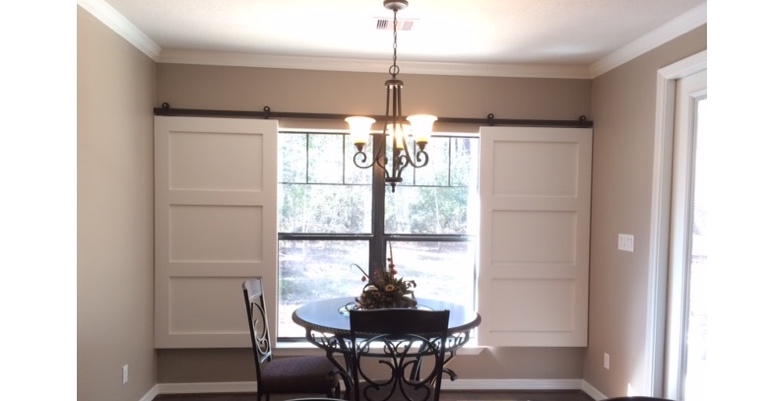 Barn doors open horizontally with slides instead of cords. Charlotte barn door shutters